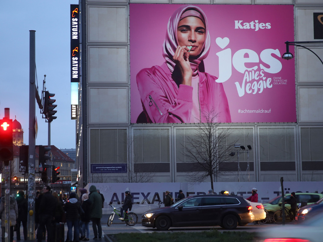 An advertisement for a new line of vegetarian sweets by German candymaker Katjes features a Muslim woman wearing a headscarf at Alexanderplatz on February 2, 2018 in Berlin, Germany.