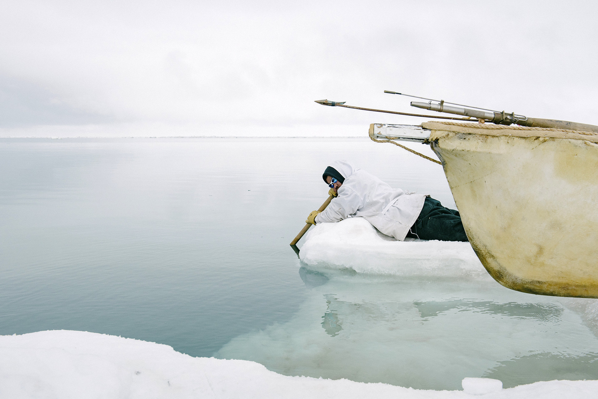 Larry Lucas Kaleak listens to the sounds of passing whales and bearded seals