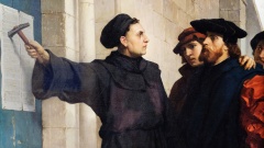 Reformator Martin Luther schlägt Thesen an die Kirchentür
