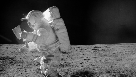 Astronaut Edgar Mitchell looks at traverse map during EVA NASA